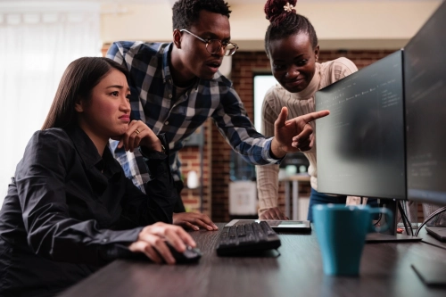 african american team leader pointing out unknown anomalies security network blockchain code multicultural development team intensively looking changes database storage settings