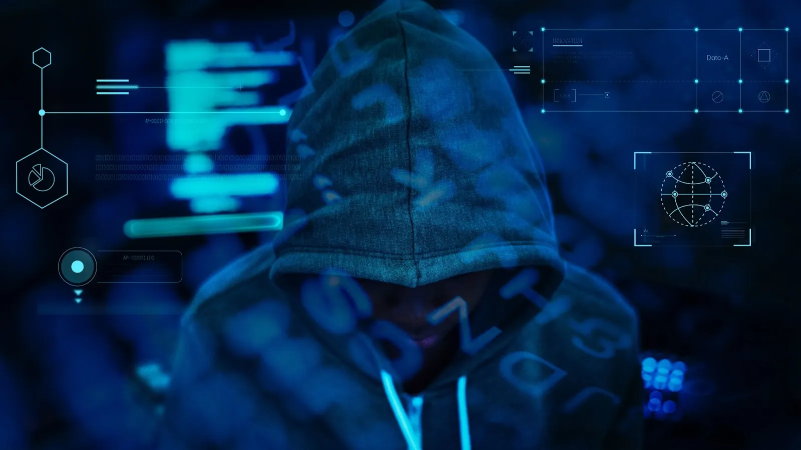Hacker working in darkness showing cybercrime environment