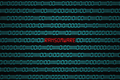 Red word "Ransomware" hidden in the middle of a binary code sequence.